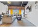 Living room with exposed brick wall, large sectional sofa, and stylish area rug at 881 Memorial Se Dr # 116, Atlanta, GA 30316