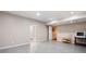 Finished basement with gray flooring and neutral paint, offering a versatile space at 1104 Fox Ln, Woodstock, GA 30188
