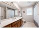 Bathroom with vanity, commode, and tiled shower at 1104 Fox Ln, Woodstock, GA 30188