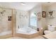 Bathroom with tub, separate shower and frosted window at 1104 Fox Ln, Woodstock, GA 30188