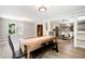 Dining room with beautiful wood floors and ample natural light at 1104 Fox Ln, Woodstock, GA 30188