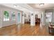 Bright and open living area featuring hardwood floors and seamless flow into dining and kitchen spaces at 1104 Fox Ln, Woodstock, GA 30188
