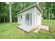 Charming outbuilding with sliding door, perfect for a studio or storage space at 1104 Fox Ln, Woodstock, GA 30188