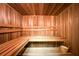 Interior wood sauna with benches and bucket, perfect for relaxation and wellness at 1104 Fox Ln, Woodstock, GA 30188