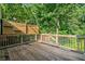 An inviting wooden back deck featuring stylish privacy fencing and ample space for entertaining or relaxing at 1139 Shiloh Nw Ln, Kennesaw, GA 30144