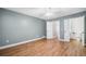 Large bedroom with wood-look floors and an en-suite bathroom at 1139 Shiloh Nw Ln, Kennesaw, GA 30144