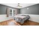 Cozy bedroom features paneled walls, natural lighting and wood-look flooring at 1139 Shiloh Nw Ln, Kennesaw, GA 30144