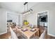 Modern dining room with neutral tones, wood floors, and stylish chandelier at 1139 Shiloh Nw Ln, Kennesaw, GA 30144