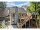 Charming home with a two-story deck, wooden stairs, and a well-maintained backyard at 1139 Shiloh Nw Ln, Kennesaw, GA 30144
