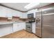 The eat-in kitchen features updated stainless steel appliances, counter tops and ample storage at 1139 Shiloh Nw Ln, Kennesaw, GA 30144