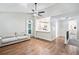 Open-concept living room with hardwood floors, high ceilings and adjacent to a kitchen with breakfast bar at 1139 Shiloh Nw Ln, Kennesaw, GA 30144