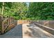 View of the large, paver-stone patio featuring a partial stone wall at 1139 Shiloh Nw Ln, Kennesaw, GA 30144