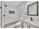 This bathroom features a black rainfall showerhead, niche and black hardware accents at 2899 Gresham Se Rd, Atlanta, GA 30316