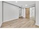 This bedroom features an en suite bathroom with a shower and white brick accent wall at 2899 Gresham Se Rd, Atlanta, GA 30316
