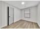 This bedroom features wood-look flooring and a full-size closet with a paneled door at 2899 Gresham Se Rd, Atlanta, GA 30316