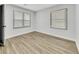 Bedroom featuring gray walls, new flooring, and a large window at 2899 Gresham Se Rd, Atlanta, GA 30316