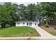 A charming one-story home with a lush green lawn and a freshly paved driveway for easy access at 2899 Gresham Se Rd, Atlanta, GA 30316