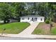 Renovated one-story home with a well-kept lawn, long driveway and enhanced curb appeal at 2899 Gresham Se Rd, Atlanta, GA 30316
