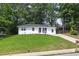 Charming single-story home featuring manicured lawn and long driveway, offering great curb appeal at 2899 Gresham Se Rd, Atlanta, GA 30316