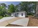 A cozy, renovated one-story home featuring a long driveway, updated paint, and charming curb appeal at 2899 Gresham Se Rd, Atlanta, GA 30316