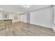 Bright living room featuring hardwood floors, bar top, and modern lighting at 2899 Gresham Se Rd, Atlanta, GA 30316
