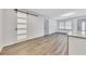 Bright living room featuring gray flooring, a sliding barn door, and modern finishes at 2899 Gresham Se Rd, Atlanta, GA 30316