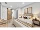 This main bedroom features art above the headboard and a barn door to the en suite bathroom at 2899 Gresham Se Rd, Atlanta, GA 30316