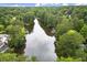 Overhead view of tranquil lake surrounded by trees, offering a serene backdrop to the neighborhood at 3545 Turtle Cove Se Ct, Marietta, GA 30067