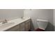 Bathroom featuring a double sink vanity with neutral-colored walls at 3545 Turtle Cove Se Ct, Marietta, GA 30067