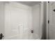 Bright bathtub featuring white walls and an integrated shower at 3545 Turtle Cove Se Ct, Marietta, GA 30067