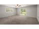 Bedroom with neutral walls, carpet, and dual pane windows at 3545 Turtle Cove Se Ct, Marietta, GA 30067