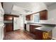 Well-equipped kitchen with ample counter space, dark wood cabinets, and modern appliances at 3545 Turtle Cove Se Ct, Marietta, GA 30067