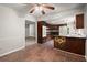 Open kitchen with modern appliances, dark wood cabinets, a breakfast bar and tile floors at 3545 Turtle Cove Se Ct, Marietta, GA 30067