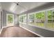 Relaxing sunroom with tile floors, large windows, and backyard view at 3545 Turtle Cove Se Ct, Marietta, GA 30067