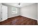 Well-lit bedroom featuring hardwood floors and neutral paint at 406 Northdale Ct, Lawrenceville, GA 30046