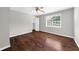 Bedroom featuring hardwood floors, neutral paint, and a ceiling fan at 406 Northdale Ct, Lawrenceville, GA 30046