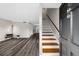 Welcoming entryway with modern gray floors, staircase, and open view to the living area at 406 Northdale Ct, Lawrenceville, GA 30046