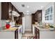 Functional kitchen with granite counters, bright lighting, and modern appliances at 406 Northdale Ct, Lawrenceville, GA 30046