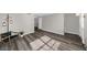 Cozy living room featuring stylish floors, a modern lamp, and a comfortable seating area at 406 Northdale Ct, Lawrenceville, GA 30046