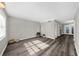 Bright living room with modern floors and natural light, perfect for relaxing or entertaining at 406 Northdale Ct, Lawrenceville, GA 30046