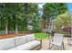 Backyard patio with cushioned seating and a grill, great for outdoor entertaining at 585 Ashland Pkwy, Woodstock, GA 30189