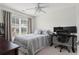 Bedroom with a desk, two monitors, a rolling office chair and a window at 585 Ashland Pkwy, Woodstock, GA 30189