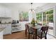 Cozy dining area with a wooden table, chairs, and a sliding glass door leading to outdoor space at 585 Ashland Pkwy, Woodstock, GA 30189