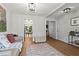 Cozy living room with hardwood floors, neutral decor, an open layout, and modern lighting fixtures at 585 Ashland Pkwy, Woodstock, GA 30189