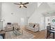 Comfortable living area with modern furniture, a patterned rug, and easy access to the kitchen at 585 Ashland Pkwy, Woodstock, GA 30189