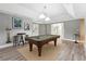 Finished basement featuring a pool table, stylish lighting, and space for recreation at 650 Garden Wilde Pl, Roswell, GA 30075