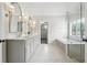Elegant bathroom with double vanity, soaking tub and glass shower at 650 Garden Wilde Pl, Roswell, GA 30075