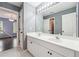 Bathroom with double vanity and a view into the purple room with the bunk beds at 650 Garden Wilde Pl, Roswell, GA 30075