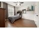 Comfortable bedroom with hardwood floors, neutral walls, and ample natural light at 650 Garden Wilde Pl, Roswell, GA 30075