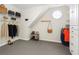 Spacious walk-in closet with custom shelving, storage drawers, and a unique round window at 650 Garden Wilde Pl, Roswell, GA 30075
